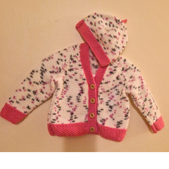 Hand Knitted Baby Cardigan and hat in Pink and white.